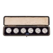 A cased set of early 20th century American or German sterling silver buttons, circa 1910