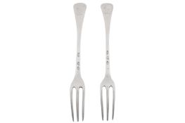 A pair of Queen Anne Britannia standard silver table forks, London 1712, attributed to Thomas Folkin