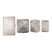 A group of four sterling silver cigarette cases