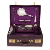 A George V sterling silver mounted fitted travelling vanity or dressing case