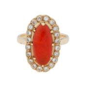 A fire opal and diamond halo ring
