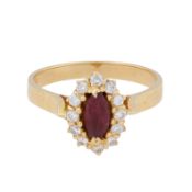 A ruby and diamond halo ring