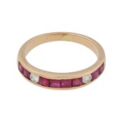 A ruby and diamond half eternity ring