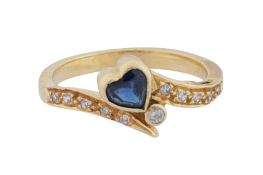 A sapphire and diamond heart ring