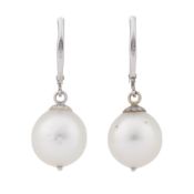 A pair of pearl dangling earrings