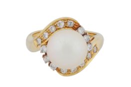 A pearl and diamond ring