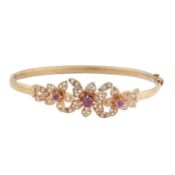A ruby and diamond flower bangle
