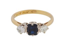 A sapphire and diamond three-stone ring