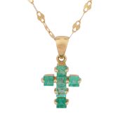 An emerald cross pendant necklace