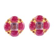 A pair of amethyst and ruby cluster studs