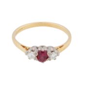 A ruby and diamond three stone ring