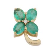 An emerald and diamond flower pendant