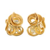 A pair of gold stud earrings, circa 1998