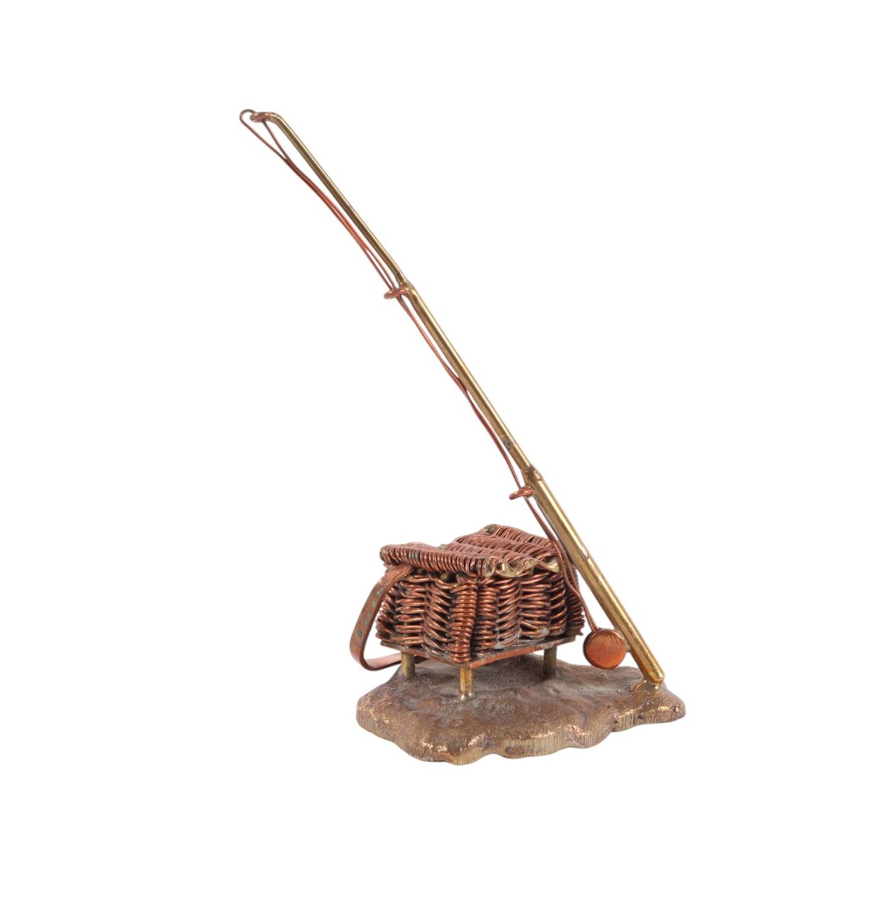 Fishing interest - A novelty brass and copper desk weight in the form of a fly-fishing rod and a