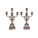 A pair of Victorian three-branch brass candelabra, 35cms high. Condition Report One candlestick is