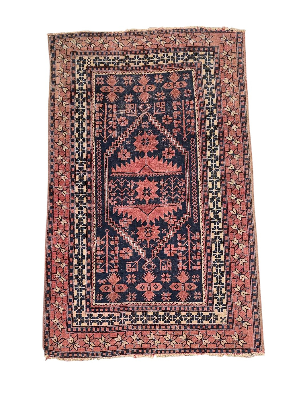 A Persian Baluch rug with geometric pattern on a red ground, 110 by 180cms.
