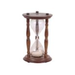 An oversized blown glass egg timer, 17cms high.