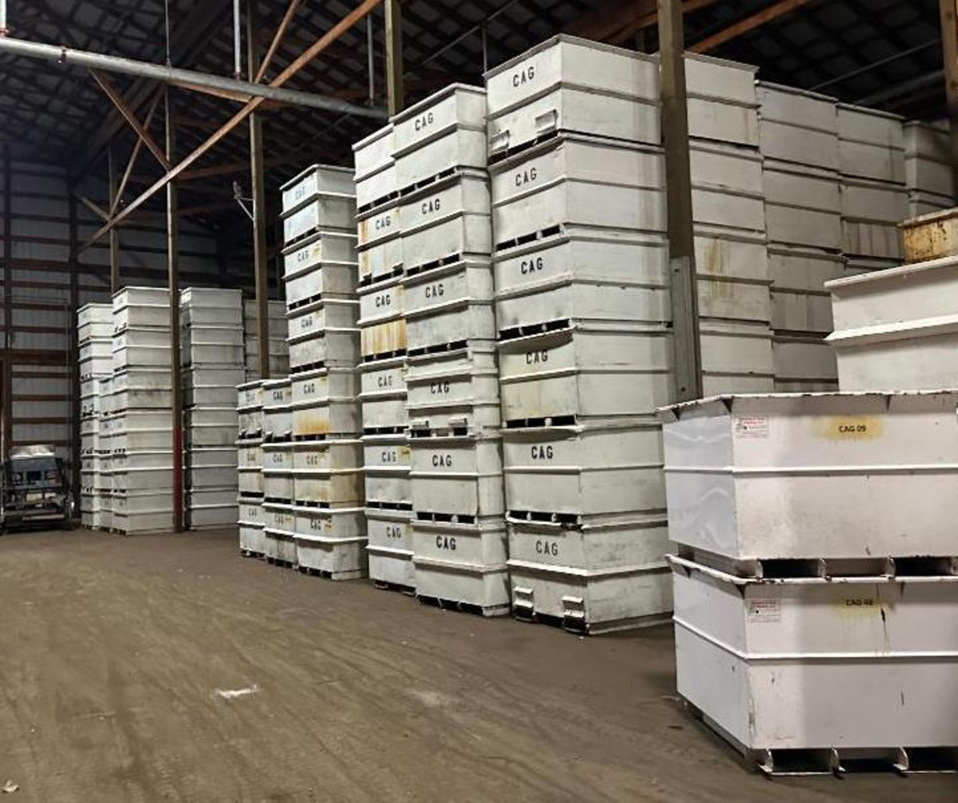 Steel bulk bin containers, 40 in. x 40 in. x 32 in. tall, stored inside ...