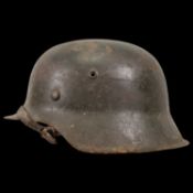 WWII Nazi German M42 Combat Helmet. The helmet shows signs of wear.