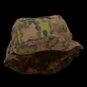 Rare WWII Nazi German cover for Waffen SS helmet, 1st type in oak leaf pattern camouflage.