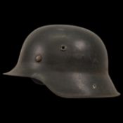 WWII Nazi German M42 Combat Helmet. The helmet shows signs of wear.