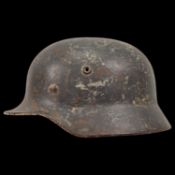 WWII Nazi German M40 Luftwaffe Combat Helmet with remnants of the Luftwaffe eagle emblem.