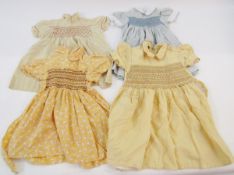 1950's/60's smocked children's dresses, one blue and cream check with puff sleeves, poplin collar