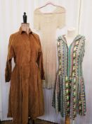 A needlecord brown dress labelled Niba size 40, a crochet dress, a multi coloured shift dress, a