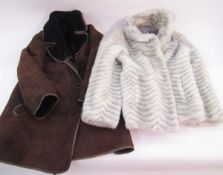 A vintage sheepskin coat, labelled Morelands, a pale blue 1940's wool coat and a camel coloured