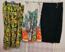 Assortment of vintage skirts to include printed cotton, green wool, wraparound skirt, striped skirt,