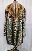 WITHDRAWN Leopard coat with mink shawl collar, labelled 'Furs by Fischer', three-quarter length,