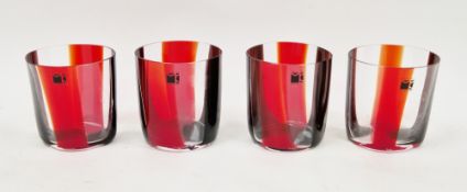 Four Italian glass tumblers by designer Carlo Moretti, each having a clear, red and brown striped