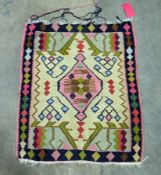 Yellow ground kilim with central lozenge medallion, geometric spandrels and single geometric border,