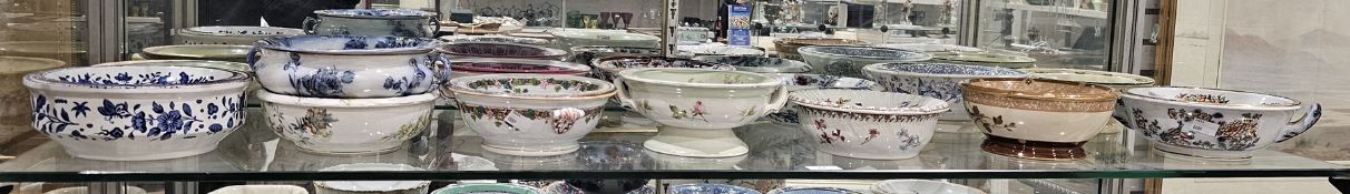 Collection of English pottery and French porcelain sponge dishes and pierced liners, 19th century