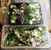 Two boxes of faux plastic flowers