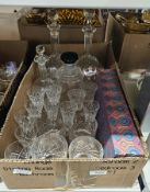 Box set of six handcut foreign sherry glasses, two cut glass decanters each with a floral