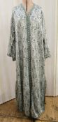 A blue and silver coloured thread embroidered kaftan, loop and button fastening all down the front
