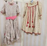 A child's Liberty style party dress with a scooped flounced over skirt with faux flower and ribbon