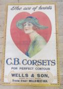 A 1920's large paper advertising poster for G B Corsets - depicting a girl wearing a straw hat,