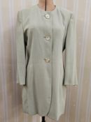 Laurel three-quarter length fitted coat with mother-of-pearl three button fastening, collarless,
