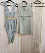 A vintage Wallis trouser suit, pale blue with printed flower design, the jacket kimono style sleeves