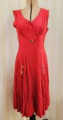 A red 1940's/50's cotton dress, the label has faded, with button detail to front panels on the skirt