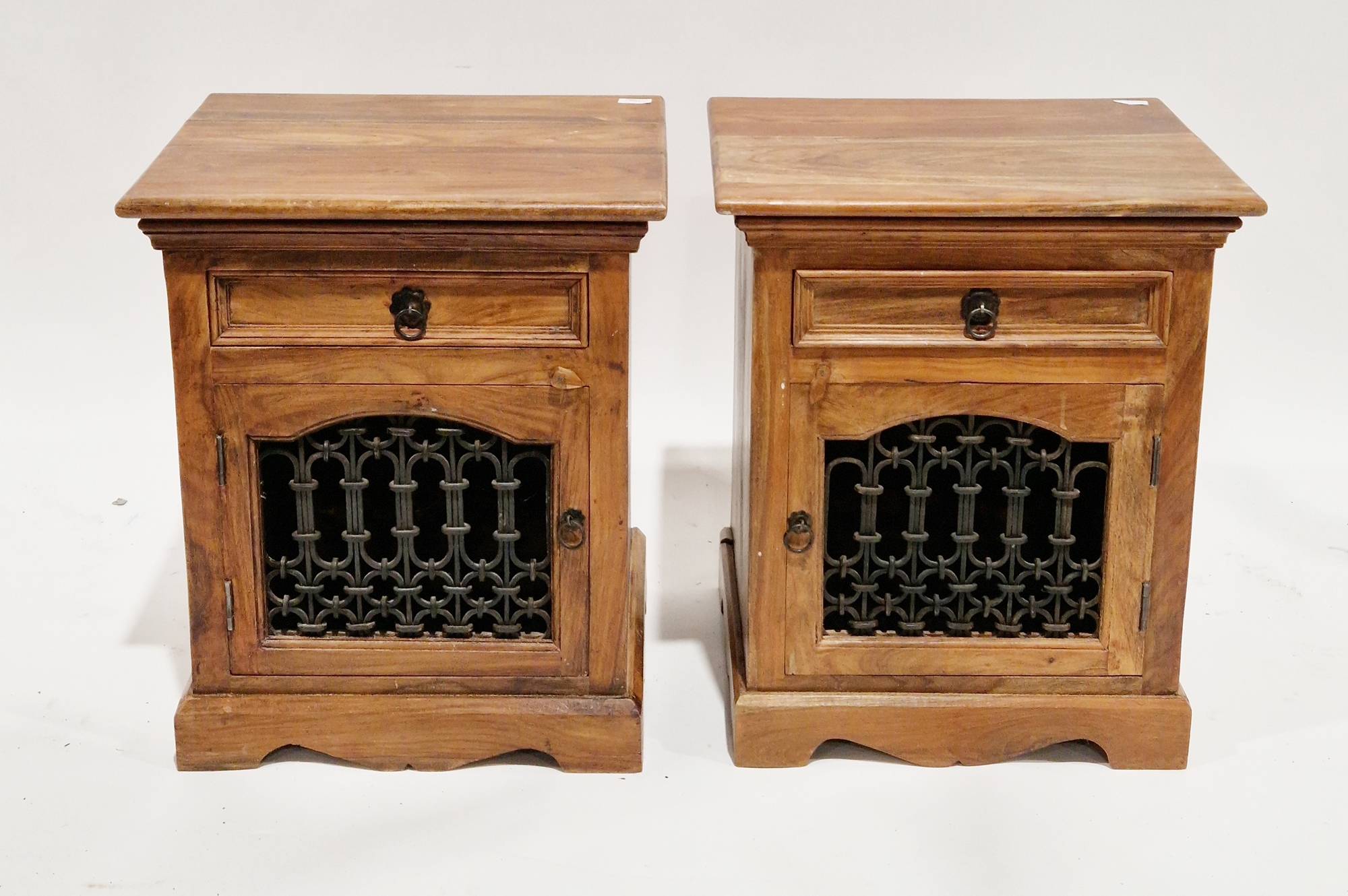 Pair of hardwood bedside cabinets, each having a single drawer with metal drop ring handle and