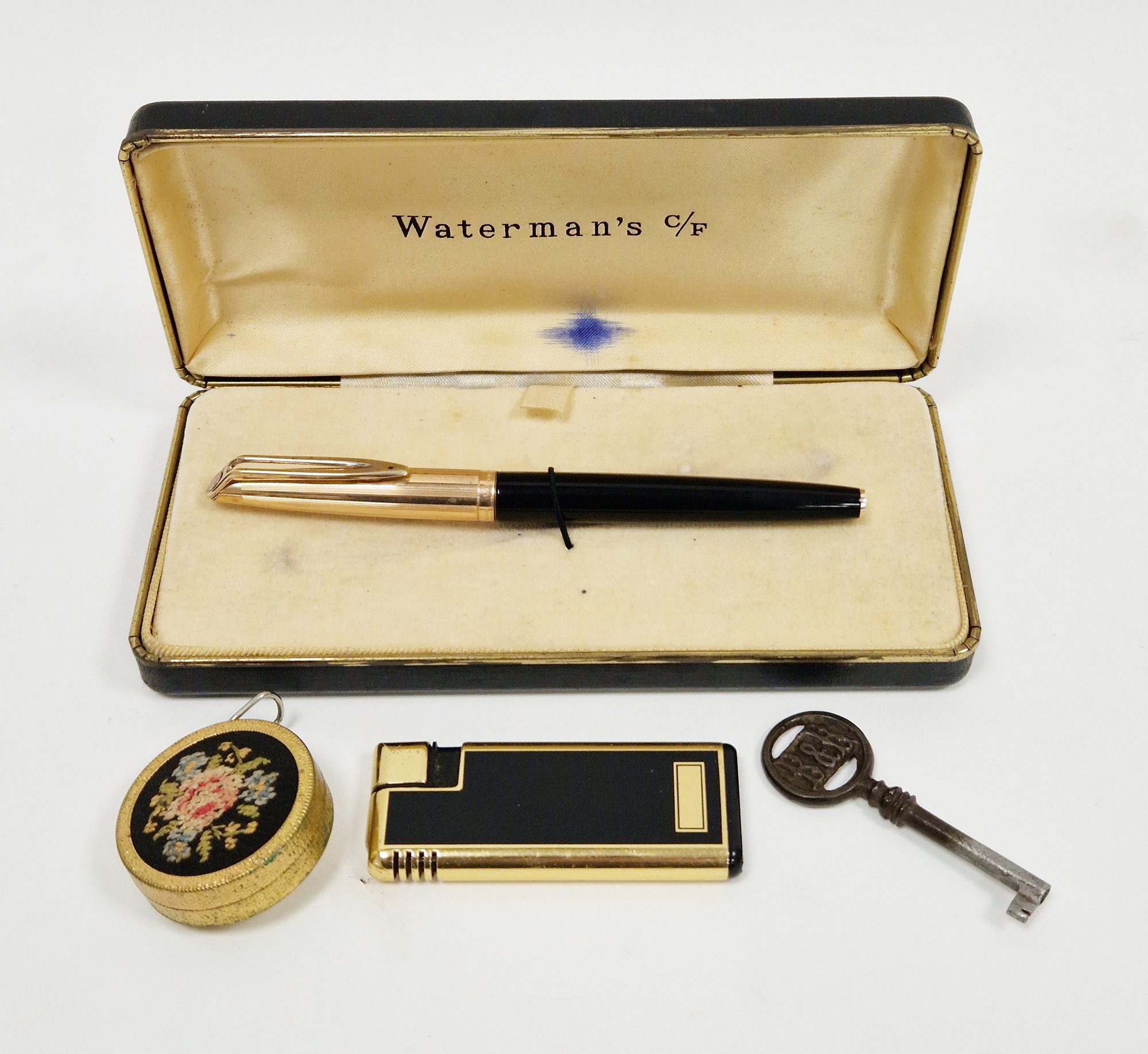 Cased Waterman's fountain pen having a rolled gold and black case with 14k gold nib together with