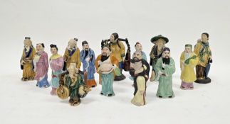 Group of Chinese Shiwan mudman figures of small size, including a water carrier, man with an