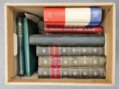 Five early 20th century stamp albums of world stamps together with a partially filled Great