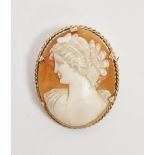 Modern 9ct gold shell cameo brooch, the oval cameo carved with a young lady within ropetwist border,
