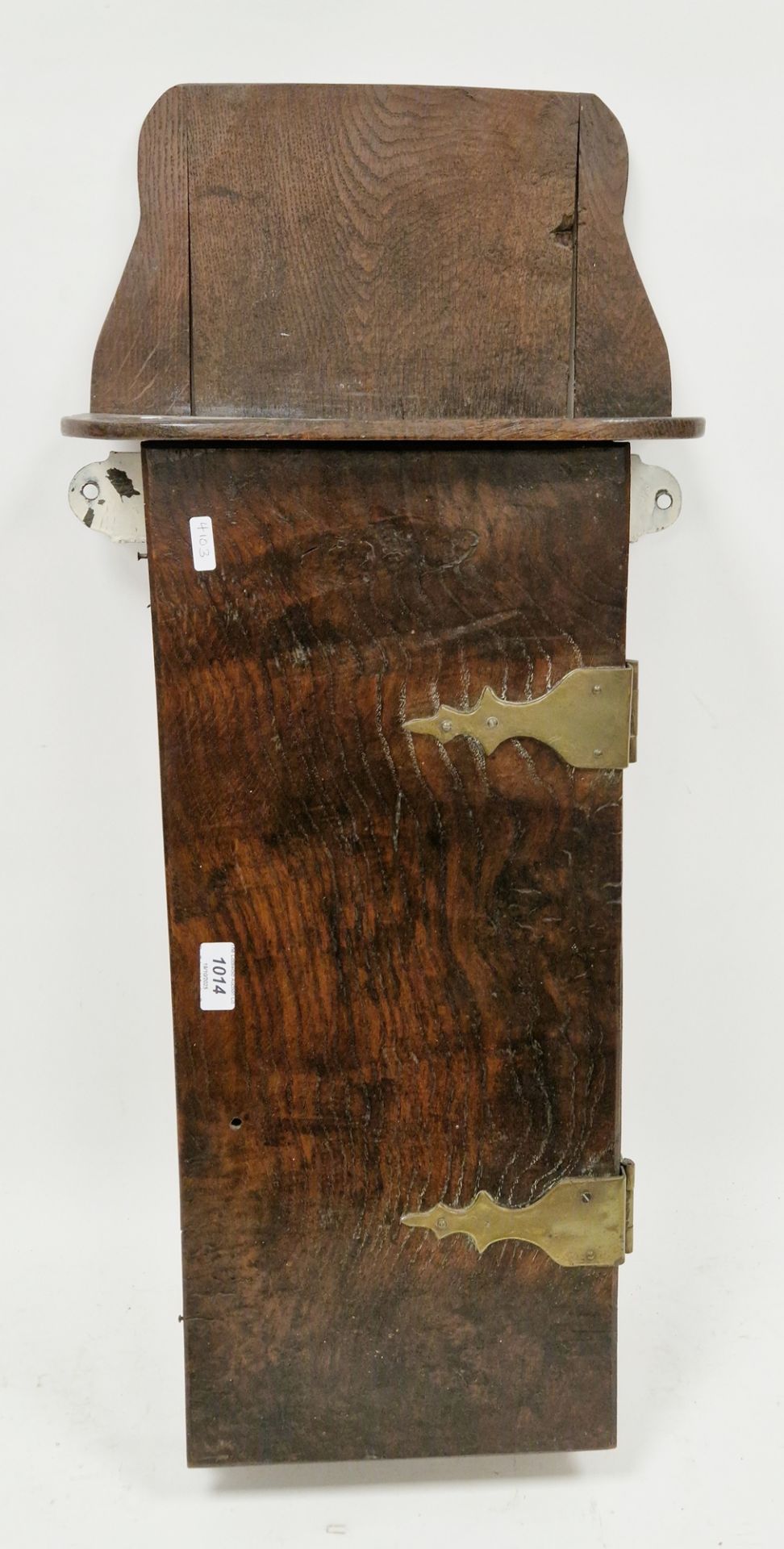 18th / 19th century oak and elm hanging wall cupboard, having shaped back, single panel door opening