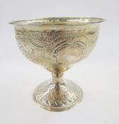 Victorian embossed footed bowl, hallmarks rubbed, the interior gilt, embossed with rocaille scrolls,