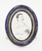 Les Must de Cartier Quartz easel back photograph frame, of oval form, in a simulated lapis lazuli